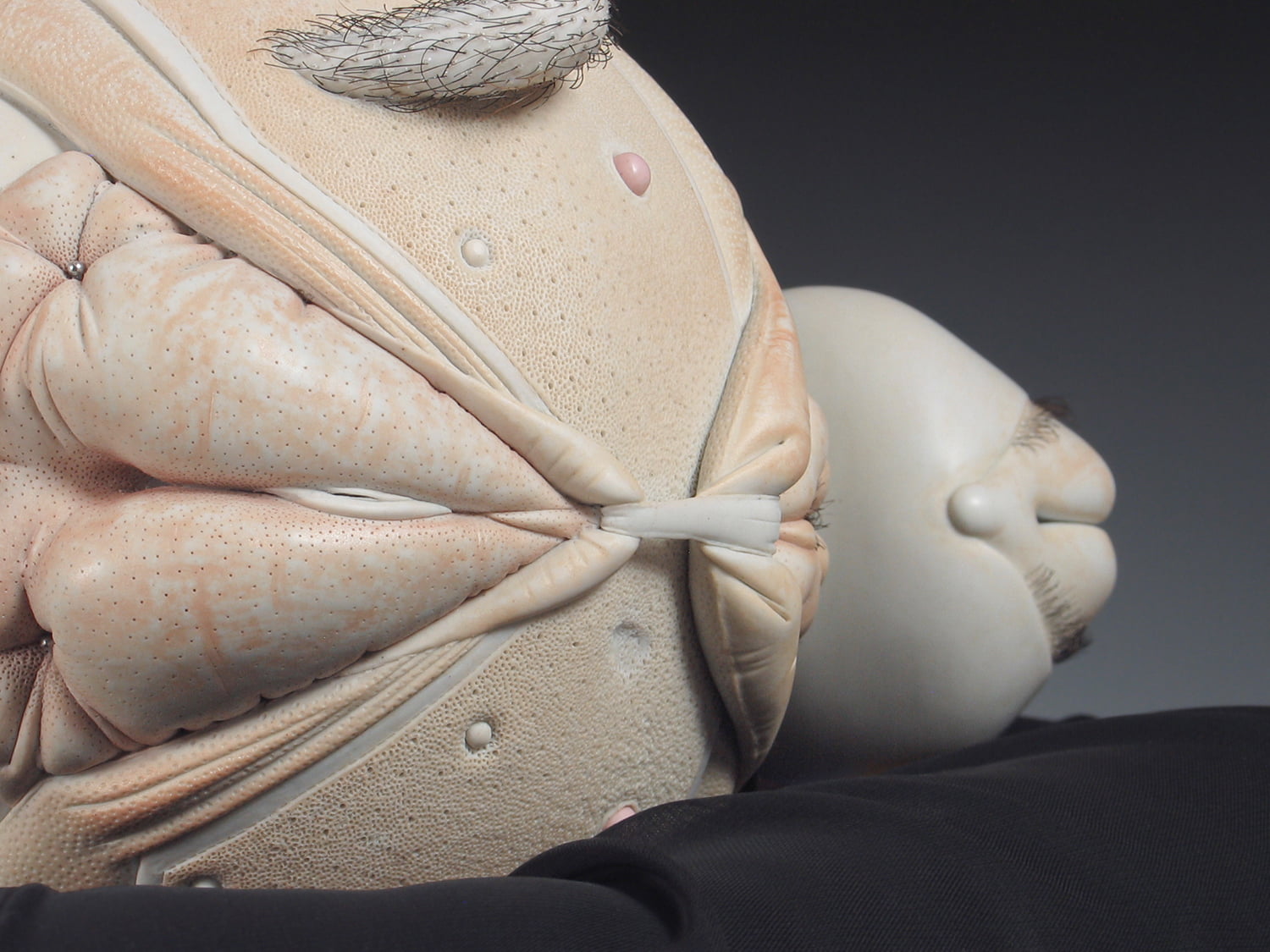 Jason Briggs "Baby" (detail 1). Porcelain, hair, and mixed media sculptural ceramic art.