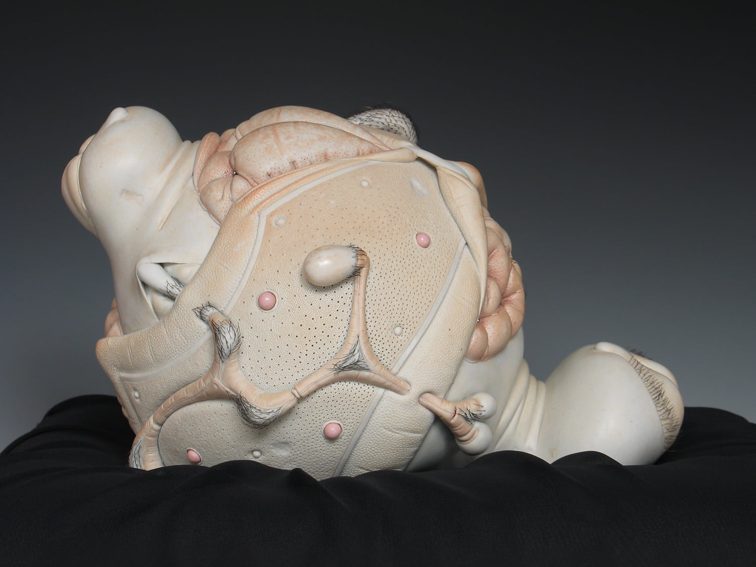 Jason Briggs "Baby". Porcelain, hair, and mixed media sculptural ceramic art.
