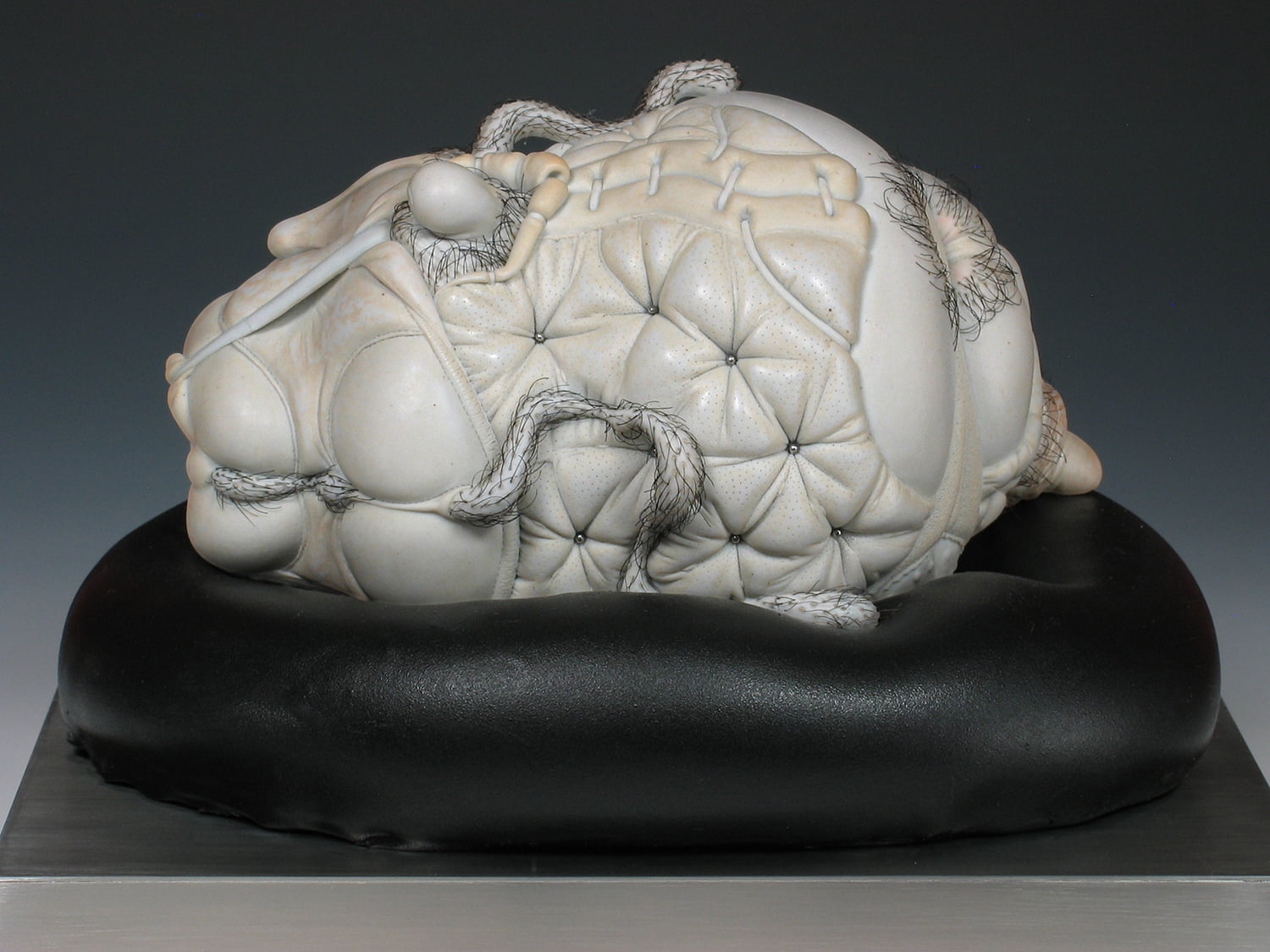 Jason Briggs "Crush". Porcelian, hair, and mixed media. Sculptural ceramic art object.