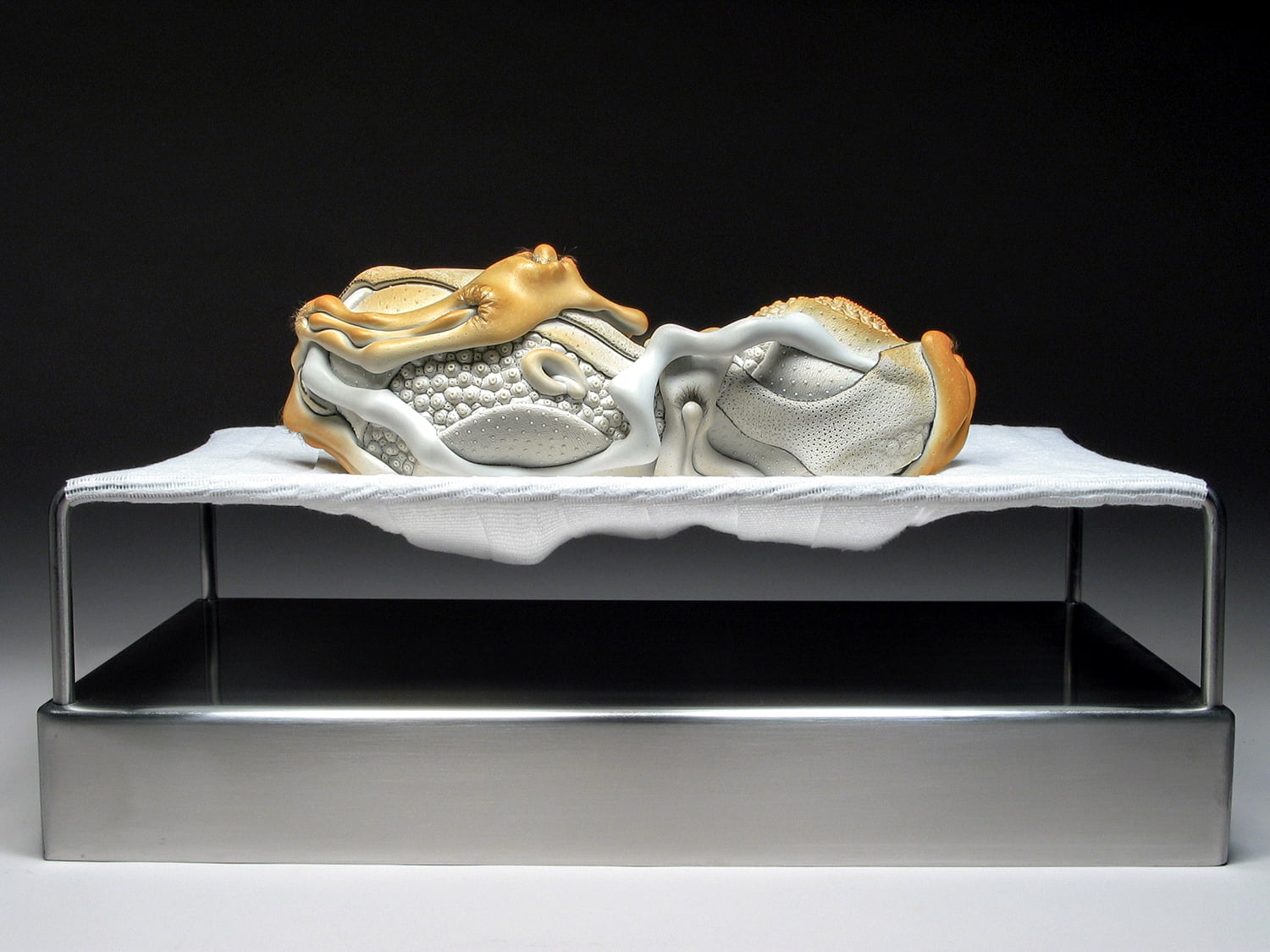 Jason Briggs "Rest" (full view). Porcelain, hair, and mixed media. Sculptural ceramic art object.