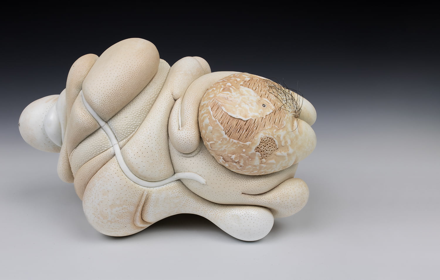 Jason Briggs "Suave" (long). porcelain, hair, and mixed media sculpture ceramics.